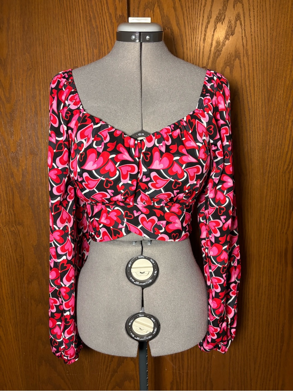 Madden NYC Heart-Print Long Sleeve Crop Top in Pink and Black. Large